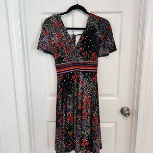 Black Floral V-Neck Flutter Sleeve Dress with Floral Red Accents.       Size XS